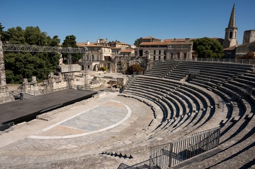 Free Discover the historic Roman amphitheater in Arles, capturing timeless architecture under clear skies. Stock Photo