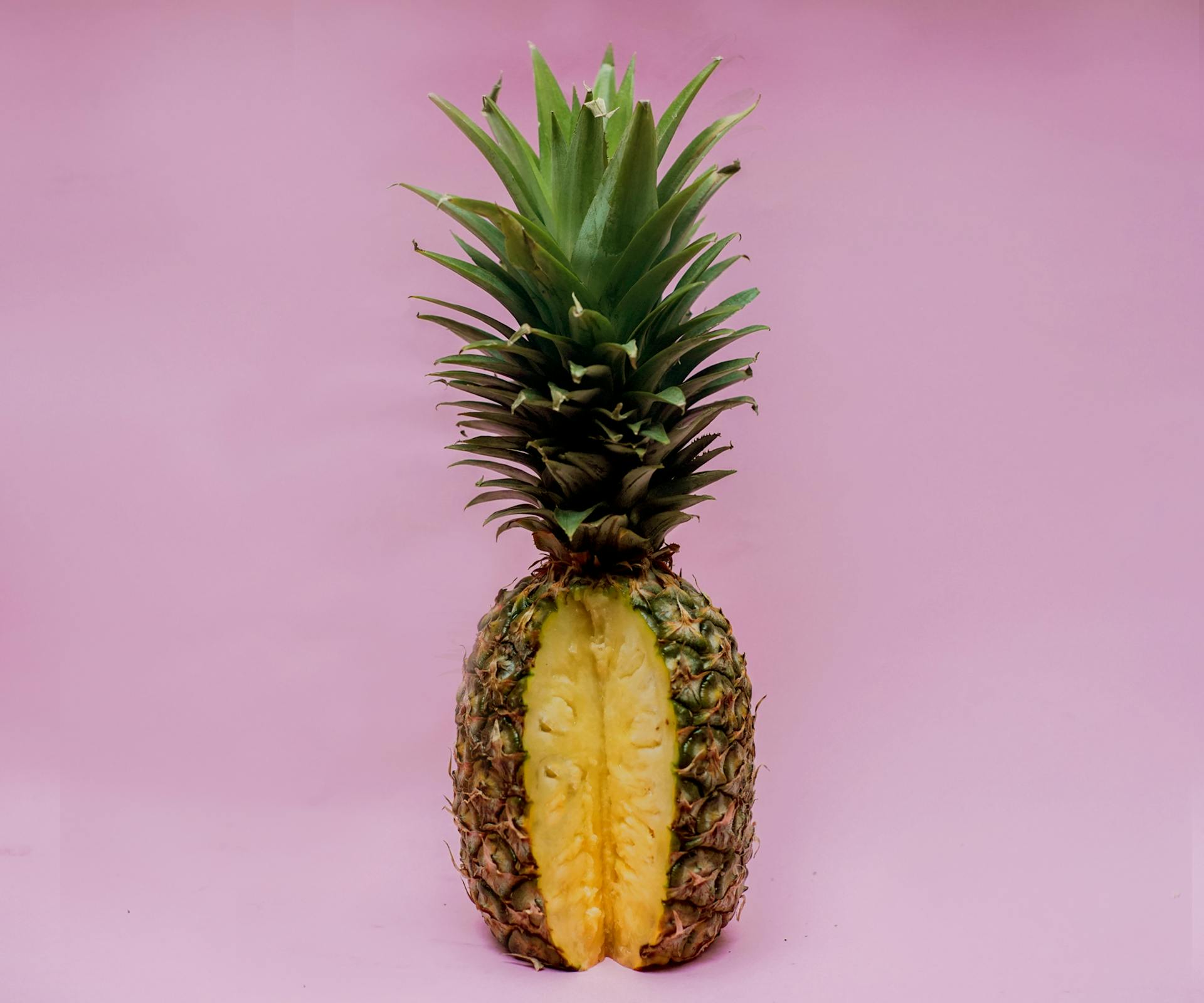 Pineapple Fruit On Pink Surface