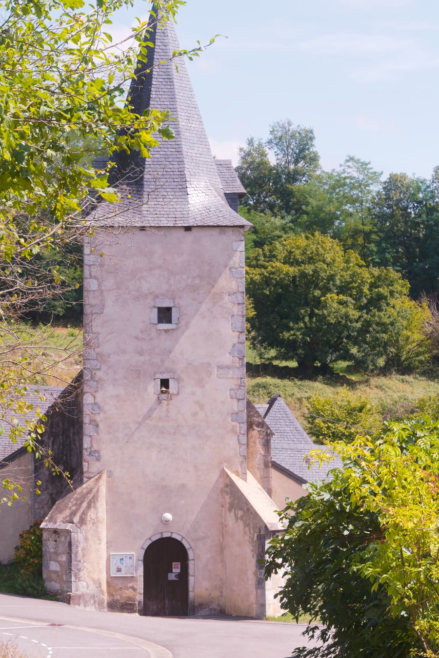 Charming Romanesque church set amidst lush greenery in Buzy, France