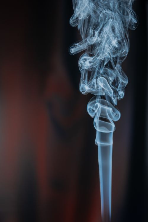 Free Artistic smoke formation swirling gracefully against a dark backdrop, creating an ethereal and mysterious atmosphere. Stock Photo