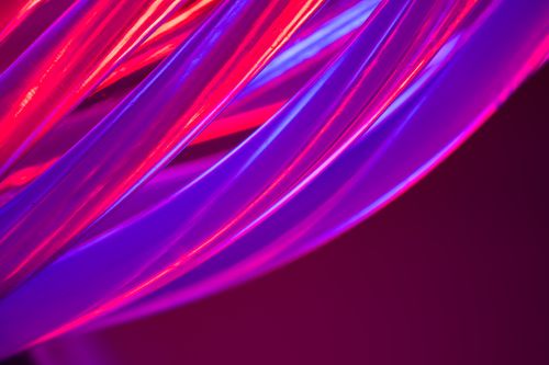 Free Dynamic abstract image featuring vibrant neon curves and lighting, evoking a modern and creative mood. Stock Photo