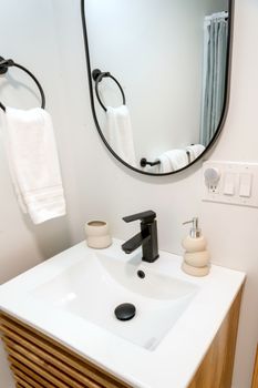 Elegant modern bathroom with minimalist sink and fixtures, perfect for chic interiors.