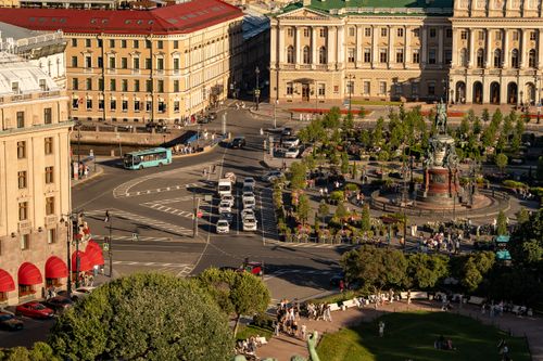 Free Aerial view showcasing the vibrant city square in St. Petersburg, Russia, with historic architecture and lively street activity. Stock Photo
