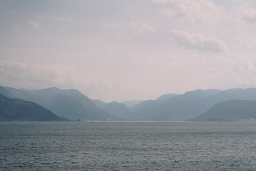 Body Of Water Near Mountains