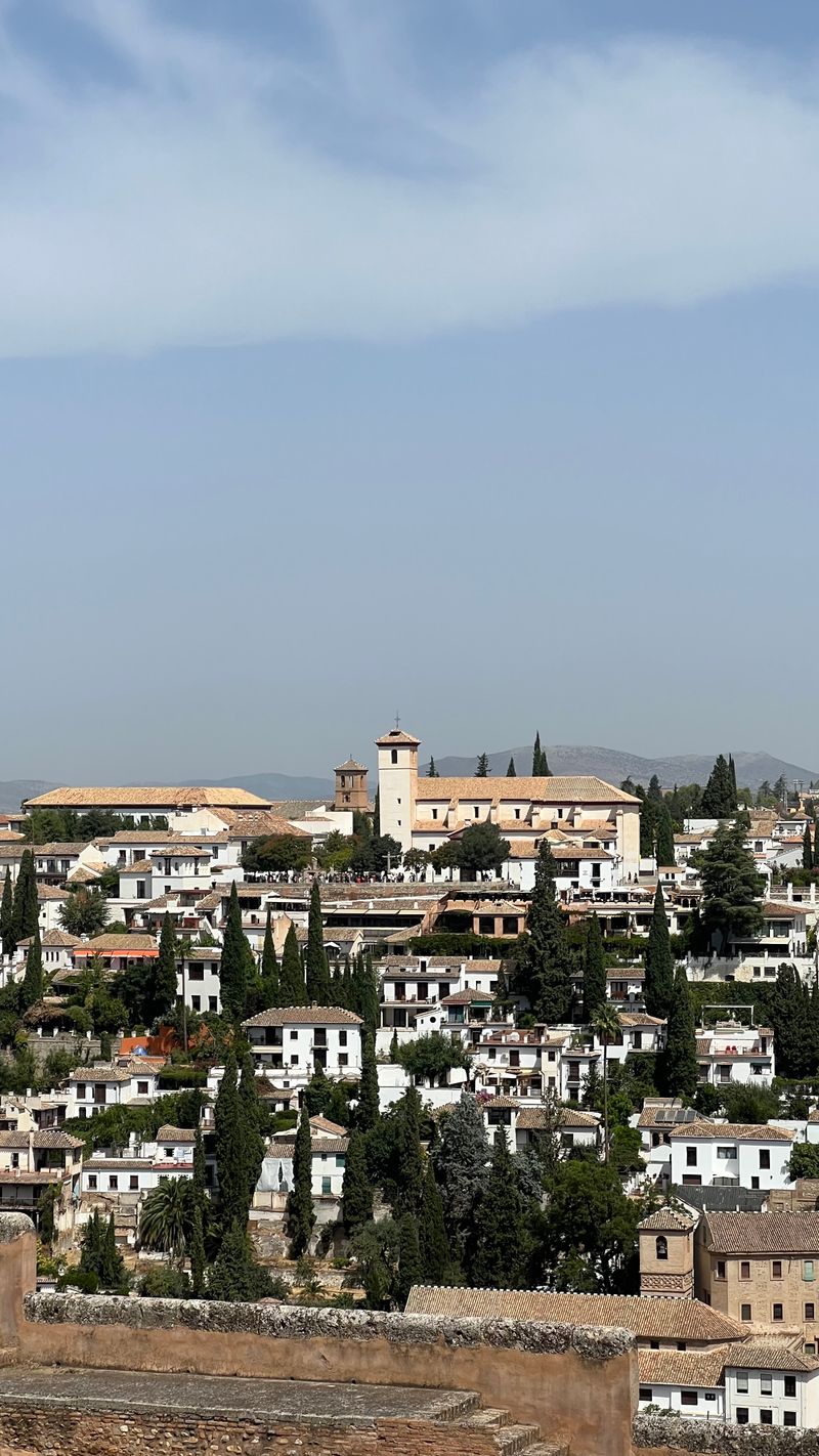 Whitewashed houses and church tower in Granada's Albaicín district