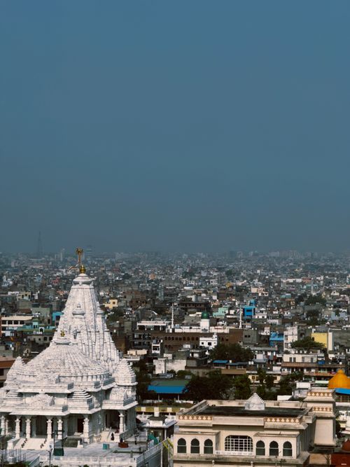 Free Scenic aerial view of Jaipur, India, featuring iconic architecture and bustling cityscape under a clear sky. Stock Photo