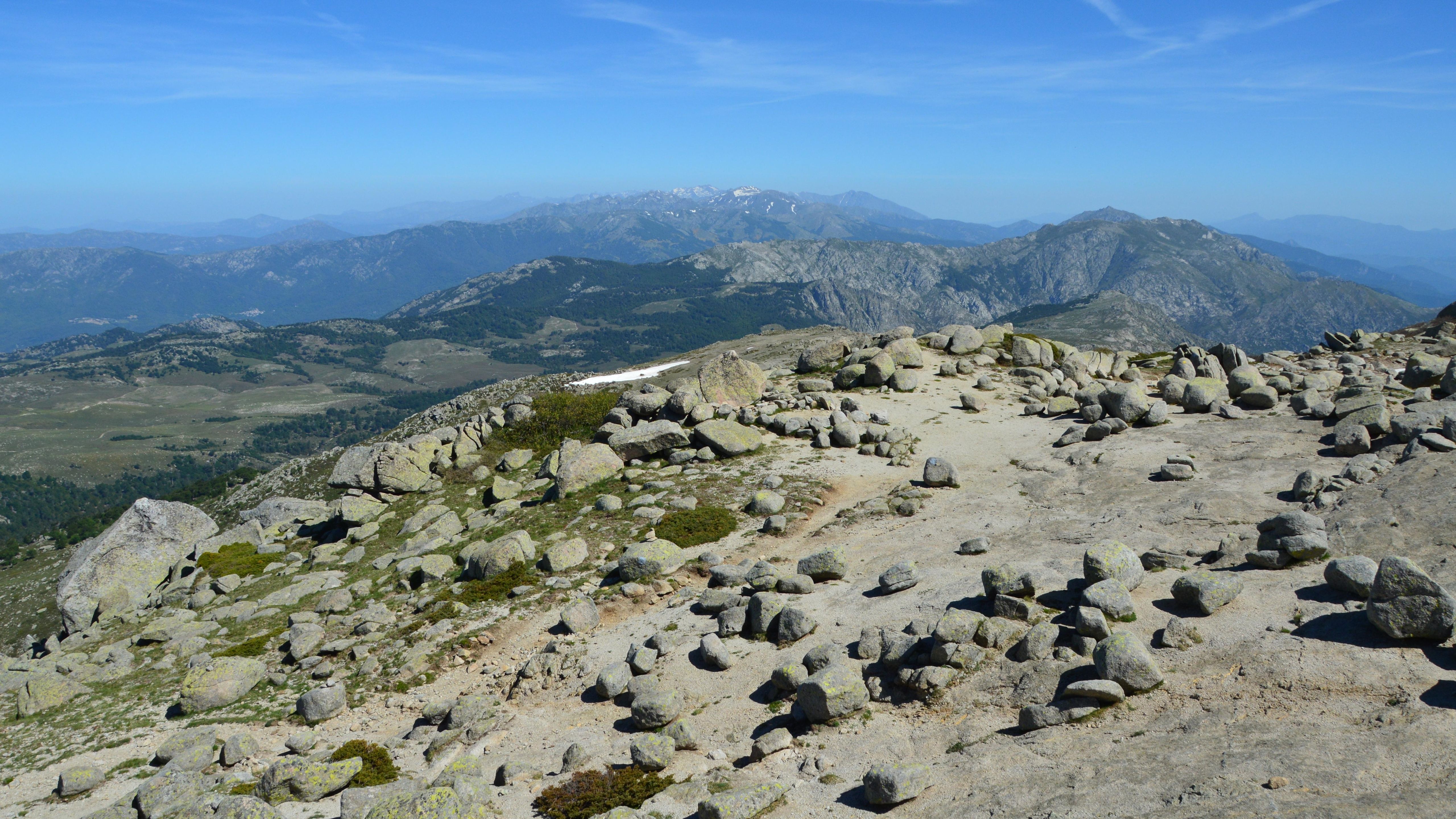 Breathtaking view of rocky mountain terrain in Quenza, Corsica on a sunny day.
