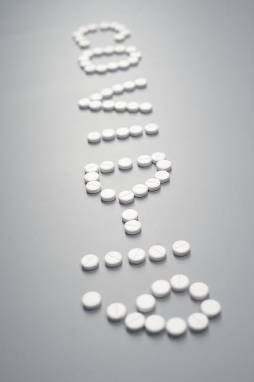 Free Pills on Gray Background Stock Photo