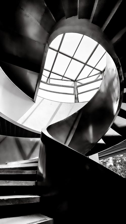 Free Black and white view of a contemporary spiral staircase in Jakarta, Indonesia, highlighting its modern design. Stock Photo