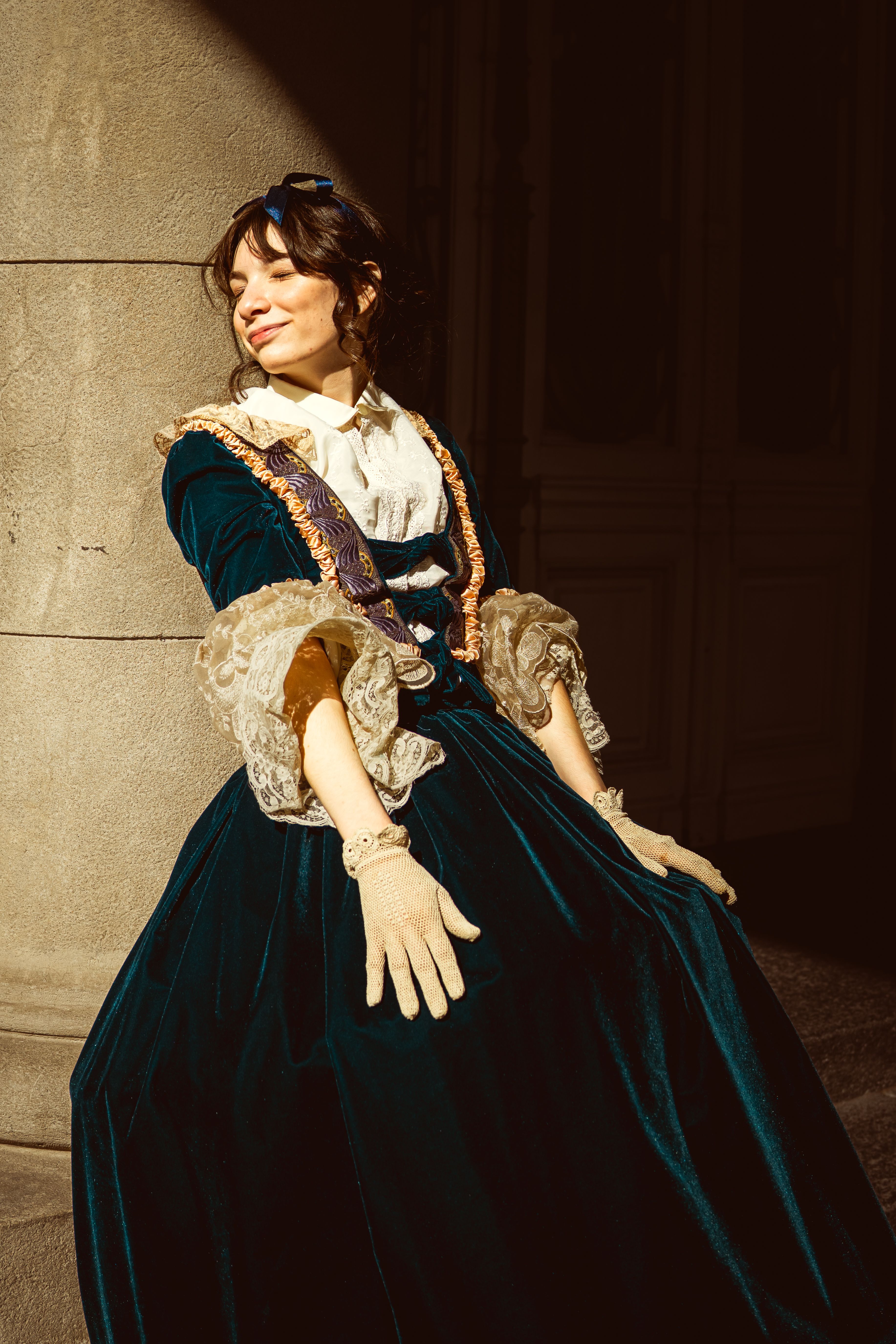 Victorian-dressed woman enjoys sunlight in Buenos Aires, Argentina.