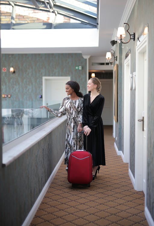 Free Women With A Luggage In Hotel Hallway  Stock Photo