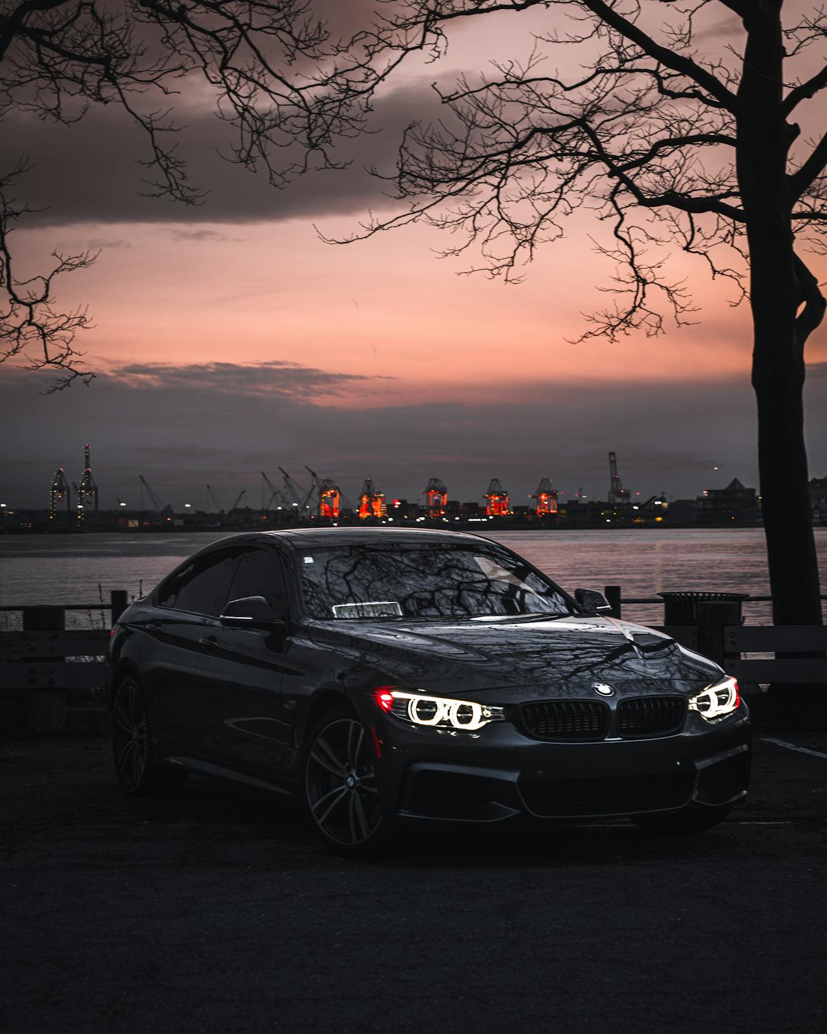 Black Bmw M 3 Parked on Parking Lot during Sunset · Free Stock Photo