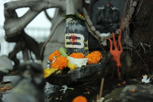 Free Traditional Hindu Shiva Lingam with marigold offerings in Raipur, India. Stock Photo