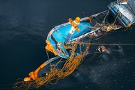 Blue And Orange Boat In Body Of Water