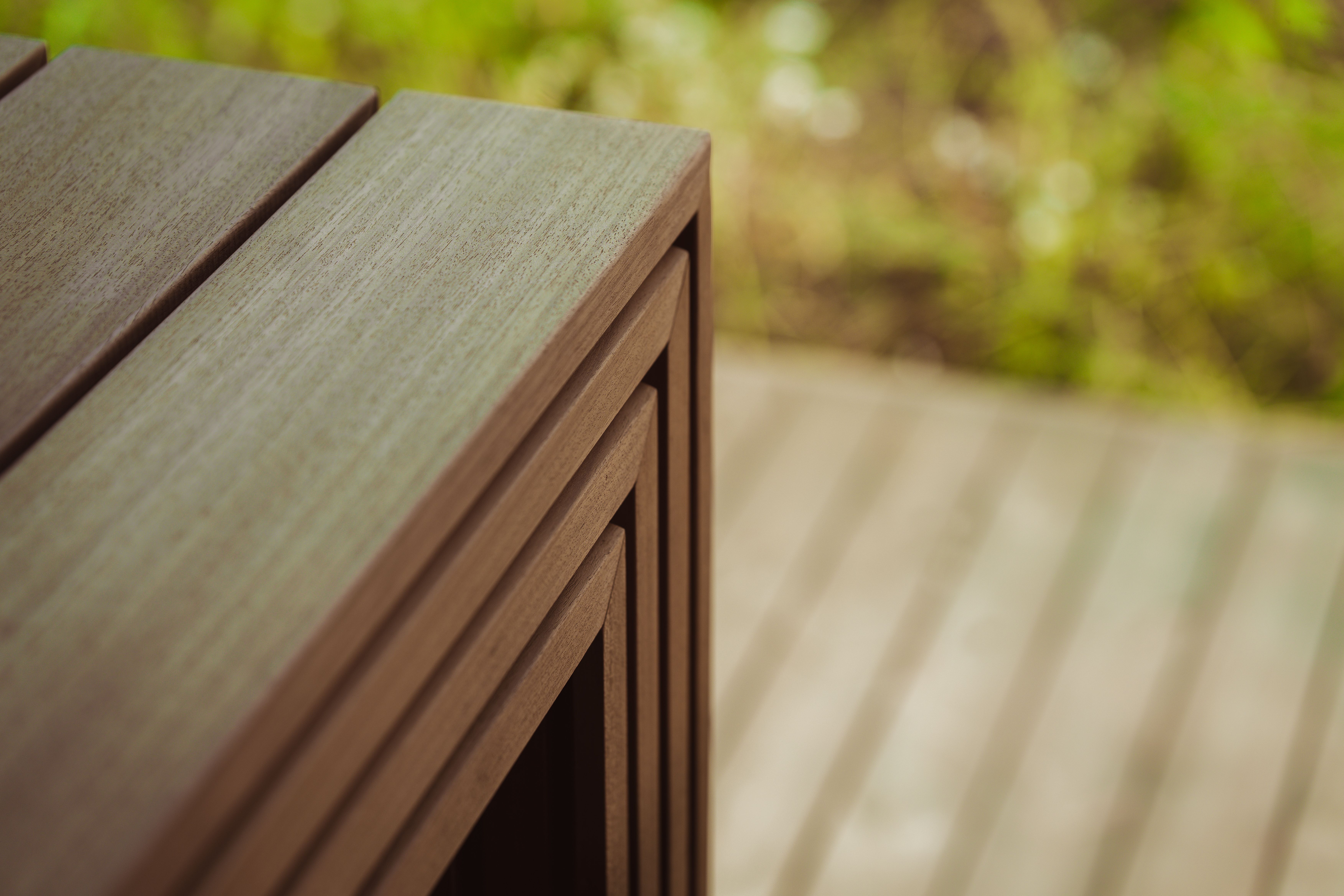 Close-up of composite deck boards installed outdoors, showcasing Trex decking texture and finish for Riverside CA homes