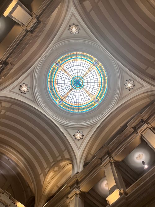 Free Elegant stained glass dome ceiling in a historic building, showcasing intricate design and craftsmanship. Stock Photo