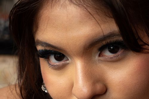 Free A closeup portrait highlighting a woman's intense and captivating eyes with detailed makeup. Stock Photo