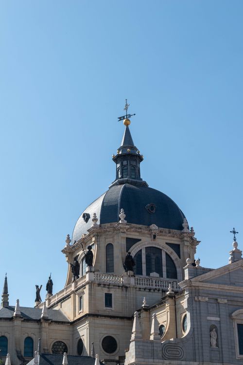 Free Stunning view of the Almudena Cathedral's dome against a clear blue sky in Madrid. Stock Photo