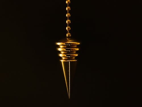 Free Hanging Gold-colored Pendant With Necklace Stock Photo