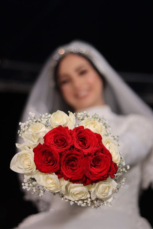 Free Bride Holding Bouquet Of Flowers Stock Photo