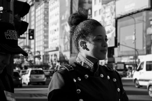 Free Black and white photo of two people at a city intersection, showcasing urban life. Stock Photo