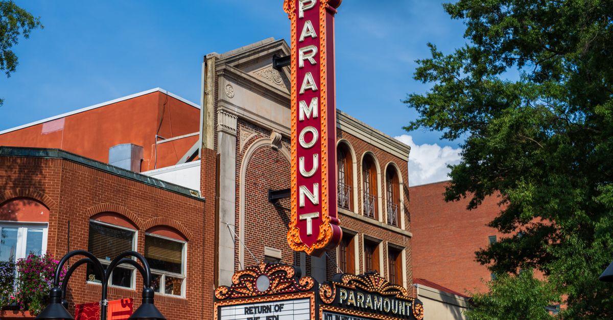 Close-up of the historic Paramount Theater marquee on a sunny day.