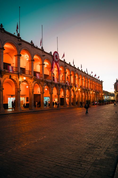 Free Colonial architecture of Plaza de Armas in Arequipa, Peru, beautifully illuminated at sunset. Stock Photo