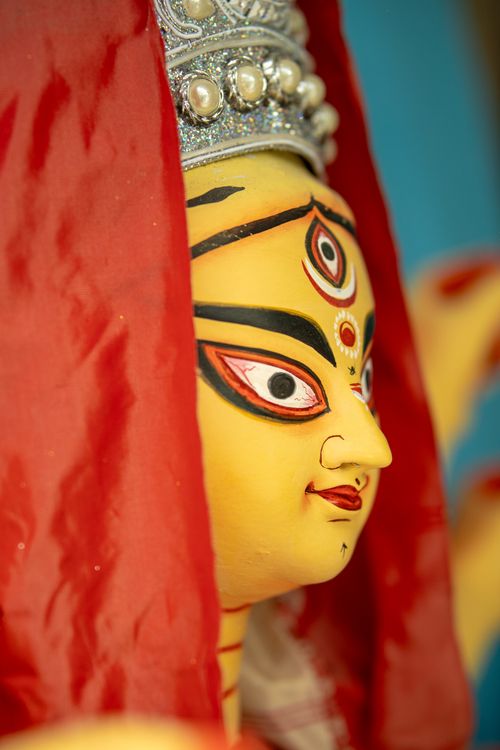 Free Close-up view of a colorful Durga idol, adorned with traditional ornaments, representing Hindu goddess worship. Stock Photo