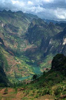 Stunning aerial view of mountains and river valley in Meo Vac, Hà Giang, Vietnam.