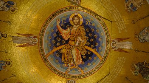 Free Intricate mosaic of Christ in a church dome, showcasing religious art and symbolism in golden hues. Stock Photo