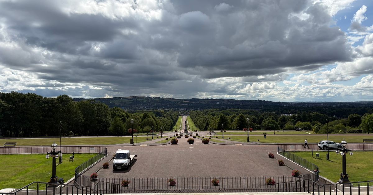 View of a scenic park in Northern Ireland with dramatic clouds and expansive greenery, perfect for travel and nature themes.