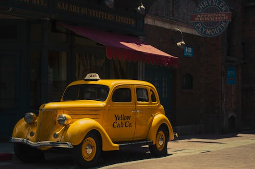 Yellow Taxi Cab On Street