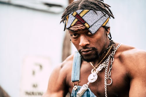 Free Man Wearing Chains With Bandana On His Head Stock Photo