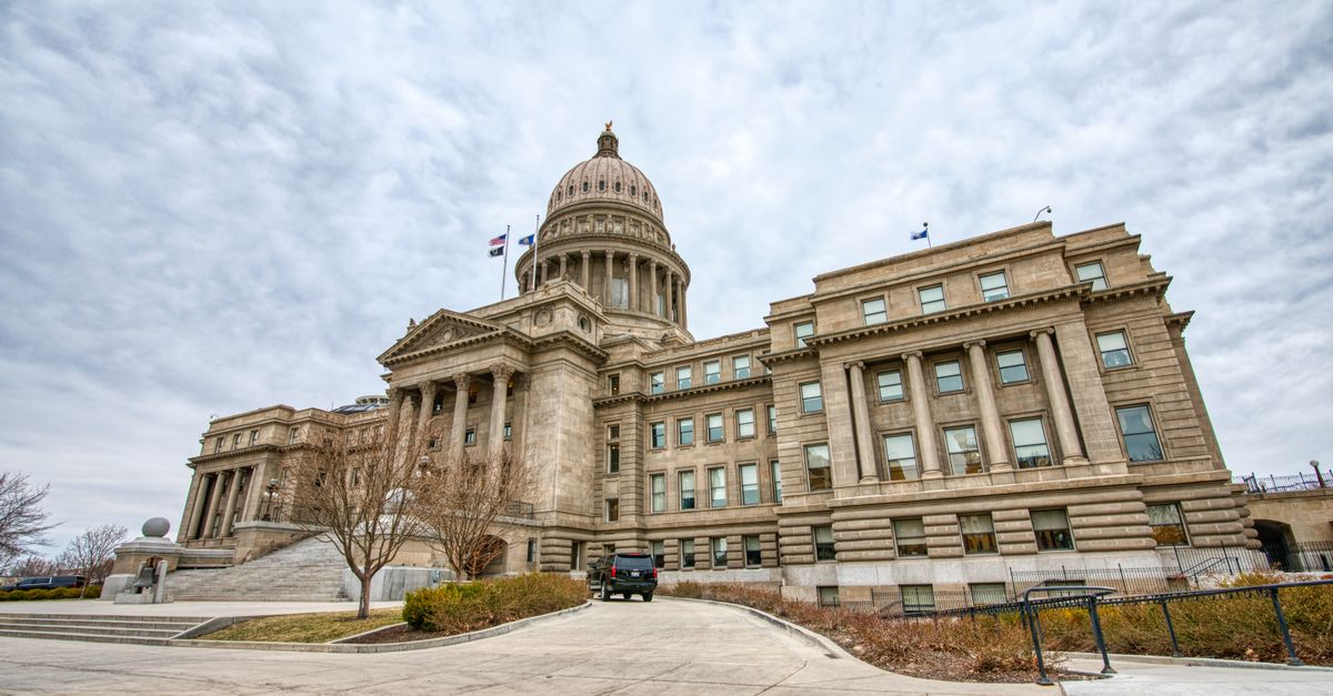 Majestic view of the Idaho State Capitol with its iconic dome under a cloudy sky.