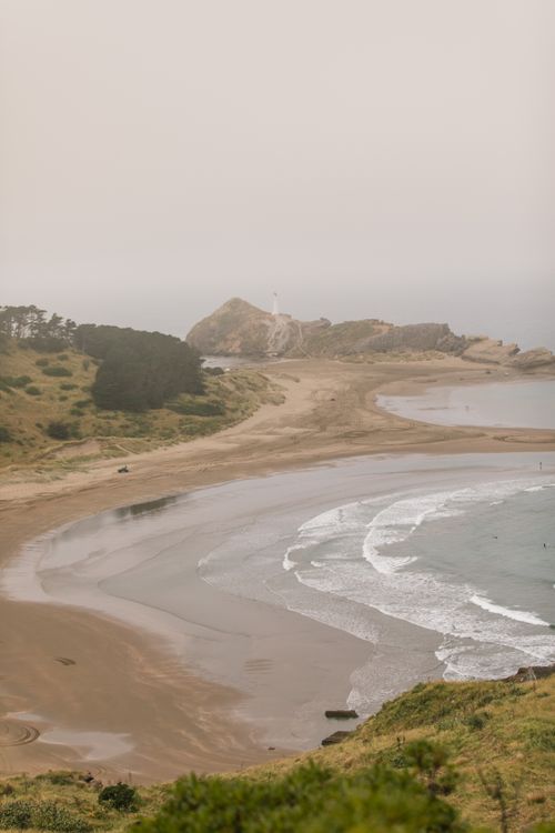 Free Scenic beach view at Castlepoint with dense fog and coastal waves in New Zealand. Stock Photo