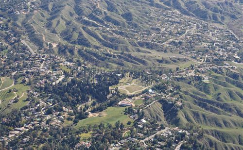 Free An aerial photograph showcasing rolling hills, suburban houses, and lush greenery. Stock Photo