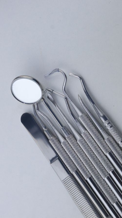 Free A set of dental instruments neatly arranged, showcasing essential tools for dental care. Stock Photo
