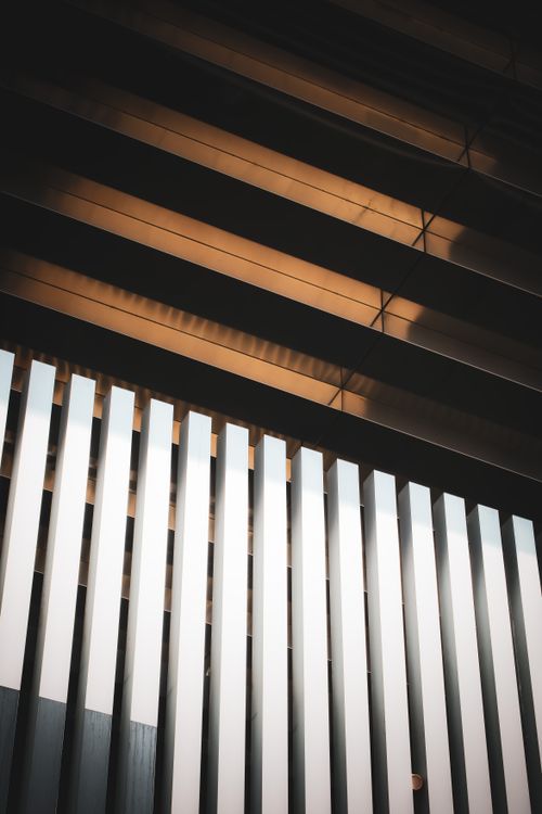 Free Symmetrical abstract view of a modern architectural ceiling with play of light and shadows. Stock Photo