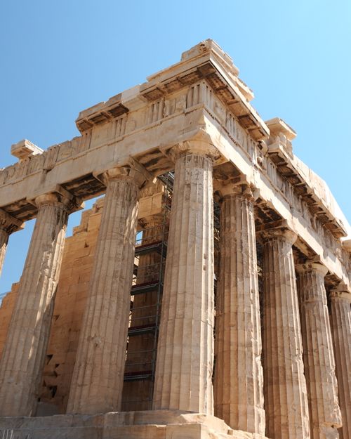 Free Close-up view of the Parthenon temple in Athens, illustrating its ancient architectural splendor under a clear blue sky. Stock Photo