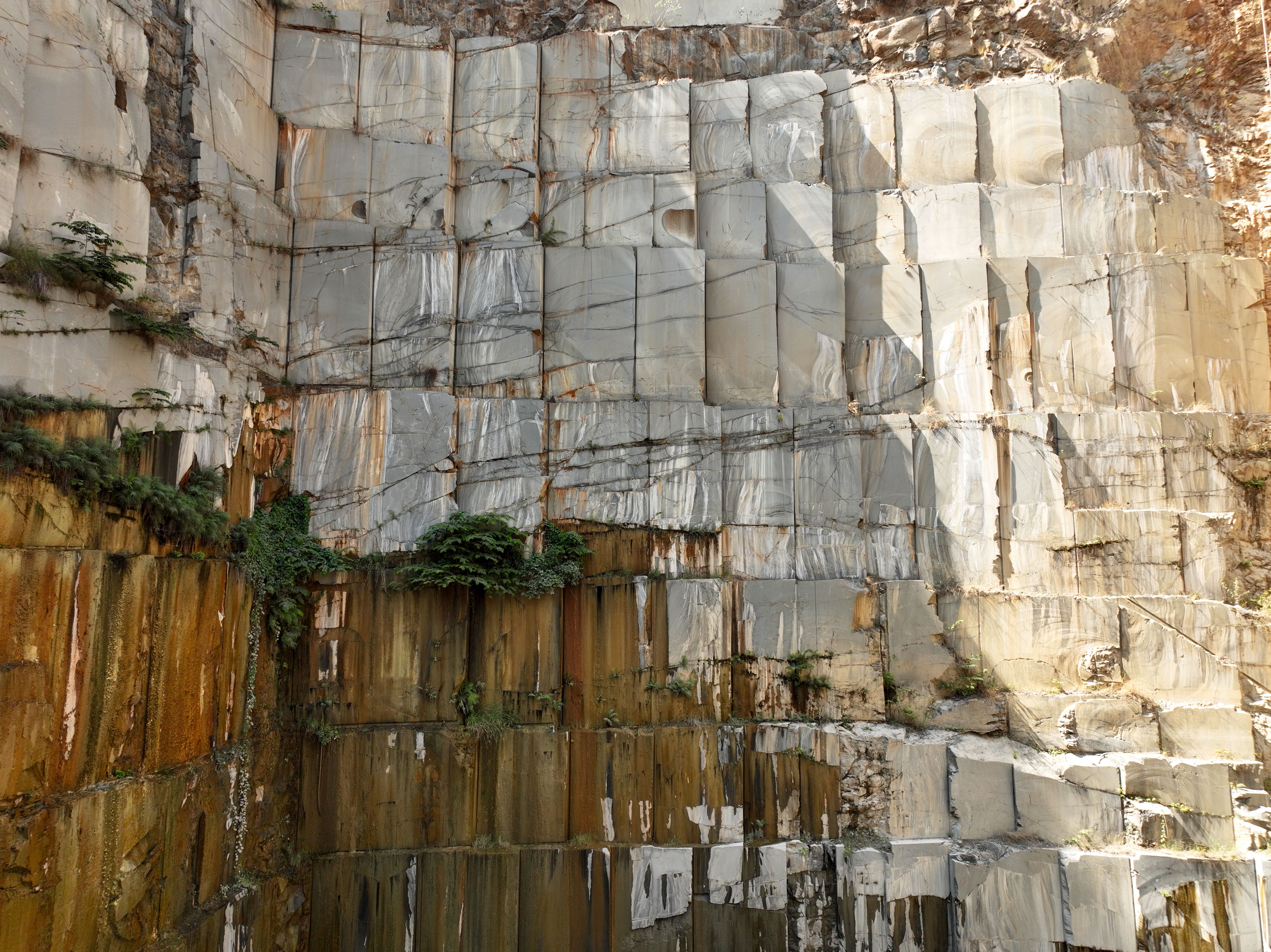 Dolomite, whether or not calcined or sintered, including dolomite roughly trimmed or merely cut, by sawing or otherwise, into blocks or slabs of a rectangular (including square) shape