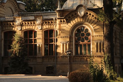 Free A beautifully detailed historic brick building with ornate arched windows and classic architecture. Stock Photo