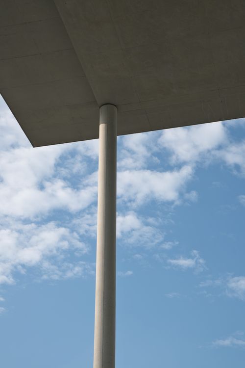 Free Minimalist view of concrete structure against a blue sky in Berlin. Stock Photo