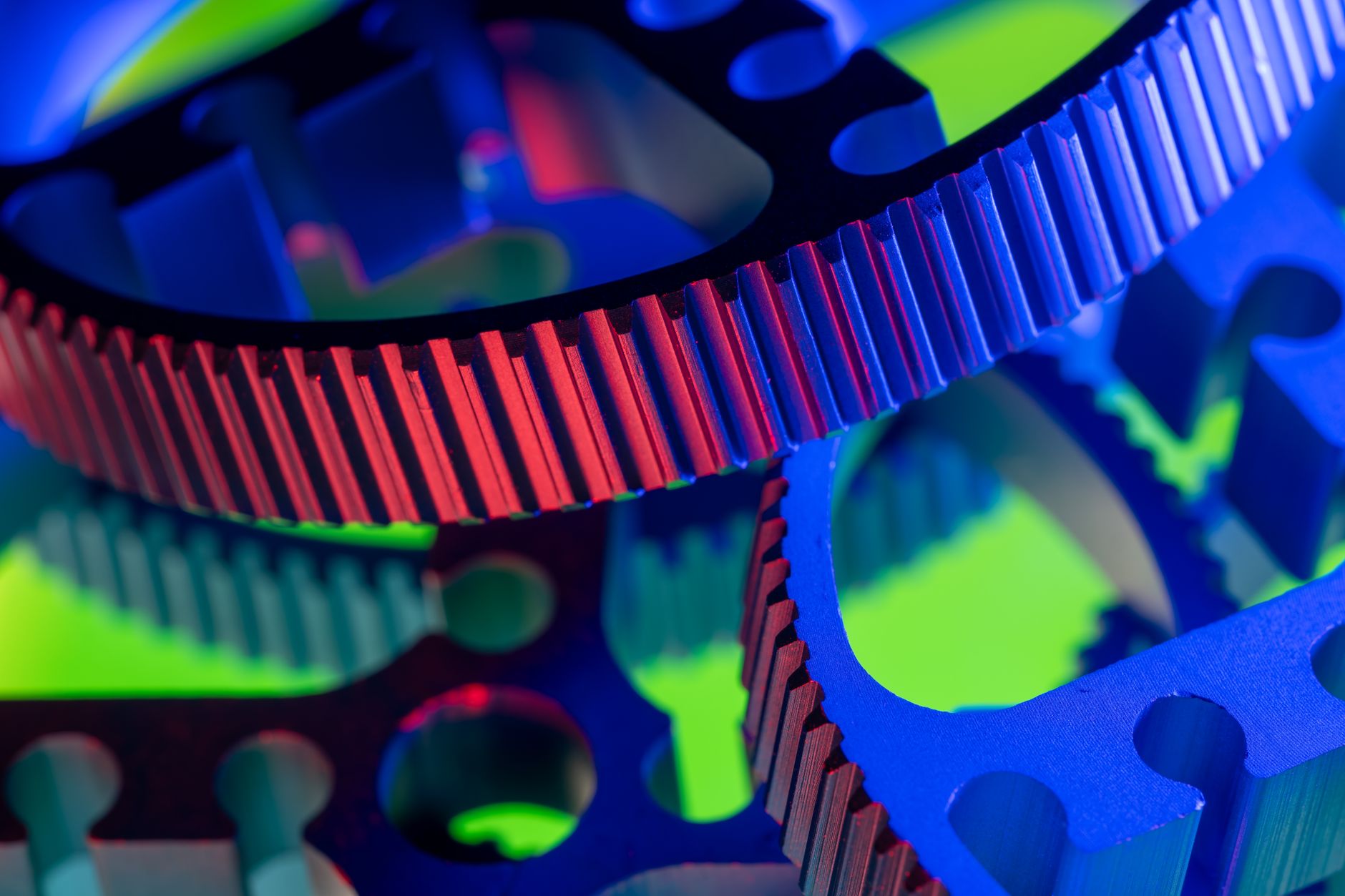 Vibrant close-up image of colorful industrial gears, showcasing precision engineering.