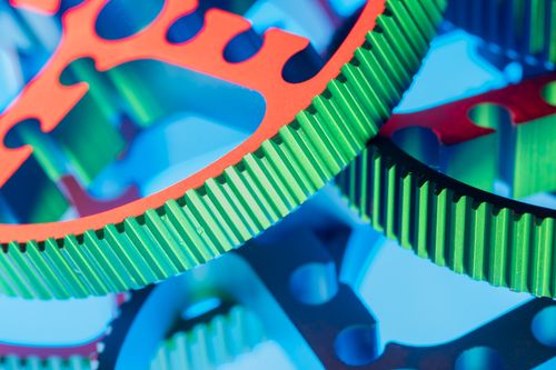 Free Vibrant macro shot of colorful interlocking gears showcasing engineering precision and modern technology. Stock Photo