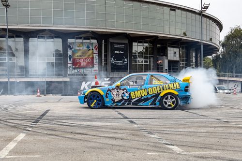 Free A colorful drift car performing stunts with smoke at the Belgrade Fairground in Serbia. Stock Photo