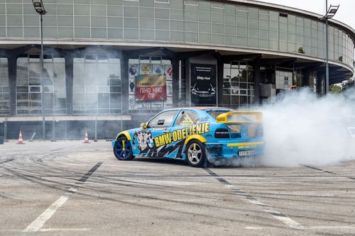 Free A dynamic scene of a car drifting outside the Beograd Fair building, Serbia. Stock Photo