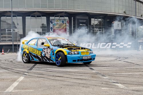 Free Dynamic shot of a colorful car drifting with smoke at the fairground in Belgrade, Serbia. Stock Photo