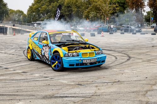 Free A bright customized car performing a drift at an outdoor event in Belgrade, Serbia. Stock Photo