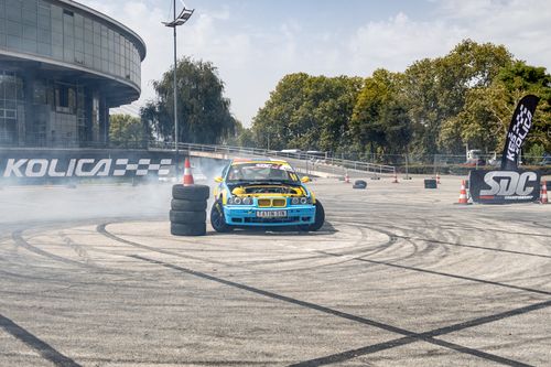 Free Exciting scene of car drifting at a motorsport event in Belgrade, Serbia, under a sunny sky. Stock Photo