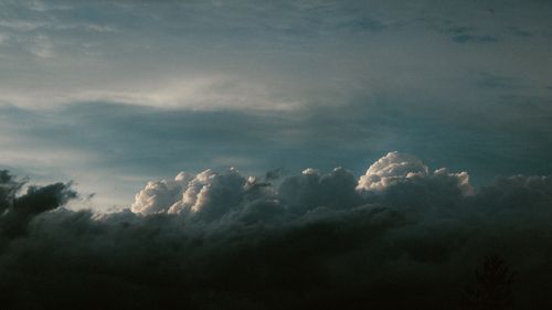 Free Stunning image of dramatic clouds forming against a clear sky, captured at twilight. Stock Photo